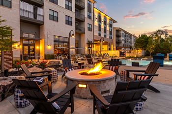 Poolside fire pit with cozy seating